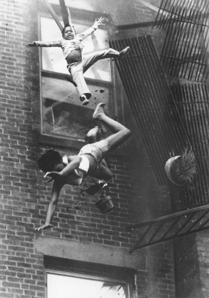 A 19-year-old woman and her 2-year-old goddaughter fall from a collapsed fire escape on July 22, 1975